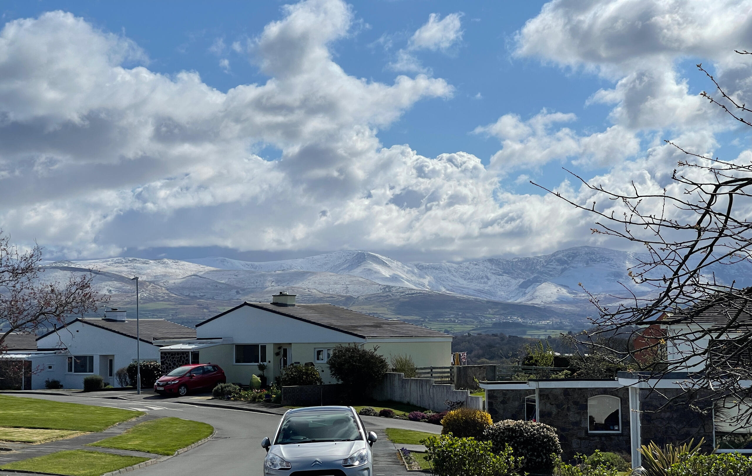 Snowdonia mountain views from The Mill Bank Retreat, Anglesey View of Snowdonia mountains from The Mill Bank Retreat holiday home in Anglesey, North Wales, perfect for family getaways and walking holidays.
